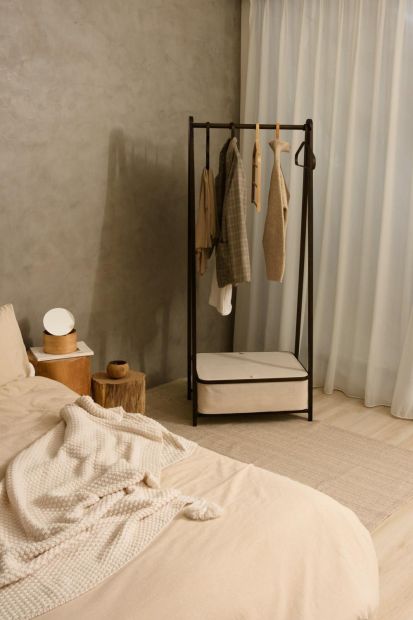 A stylish and functional coat rack with storage capabilities